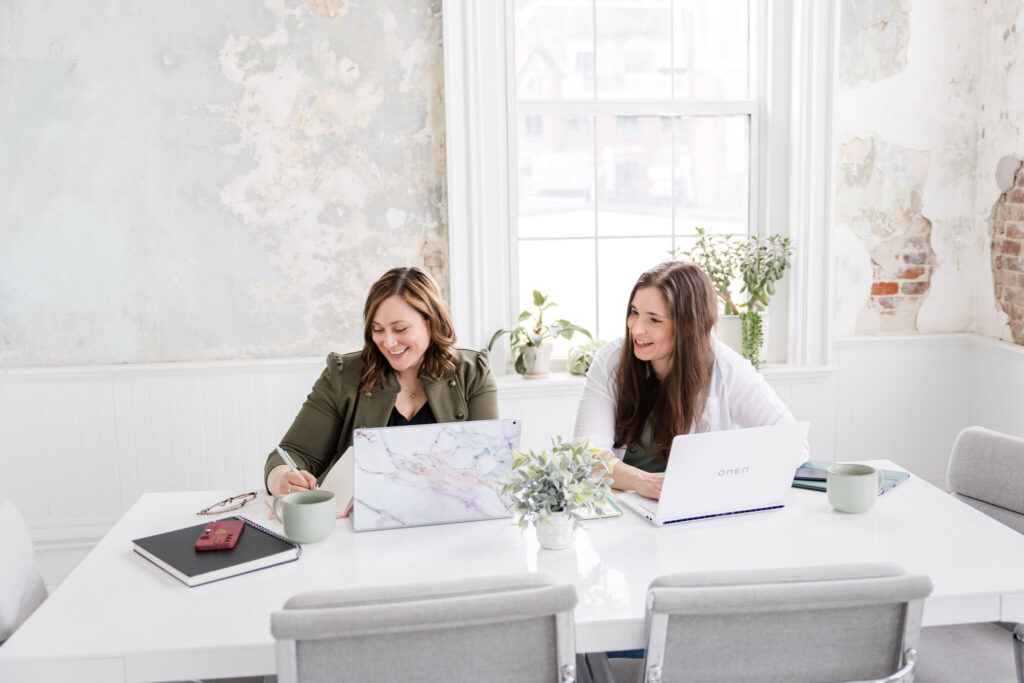 megan and lauren working at desk on food and beverage franchise strategies
