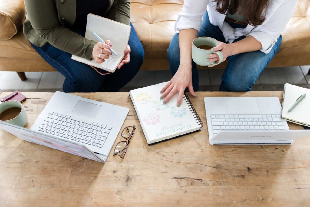 close up of Trebletree founders Megan and Lauren working on franchise content marketing strategy