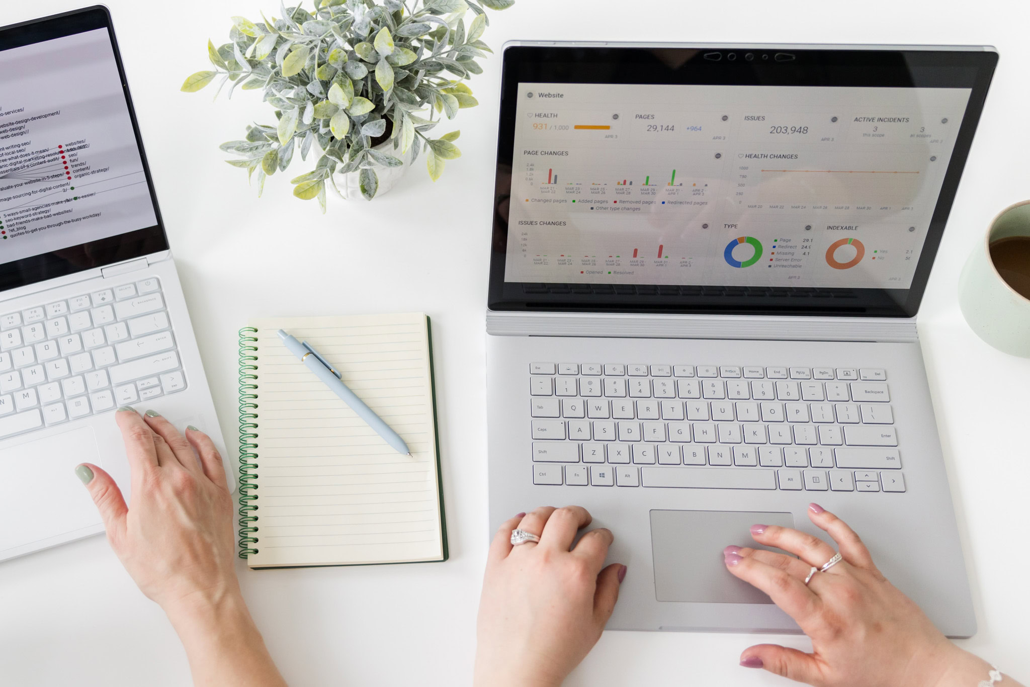 laptops on table with SEO stats on screens