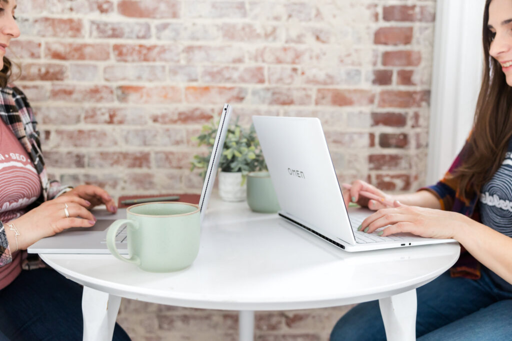 close up of megan and lauren working on geo and writing ai-friendly content