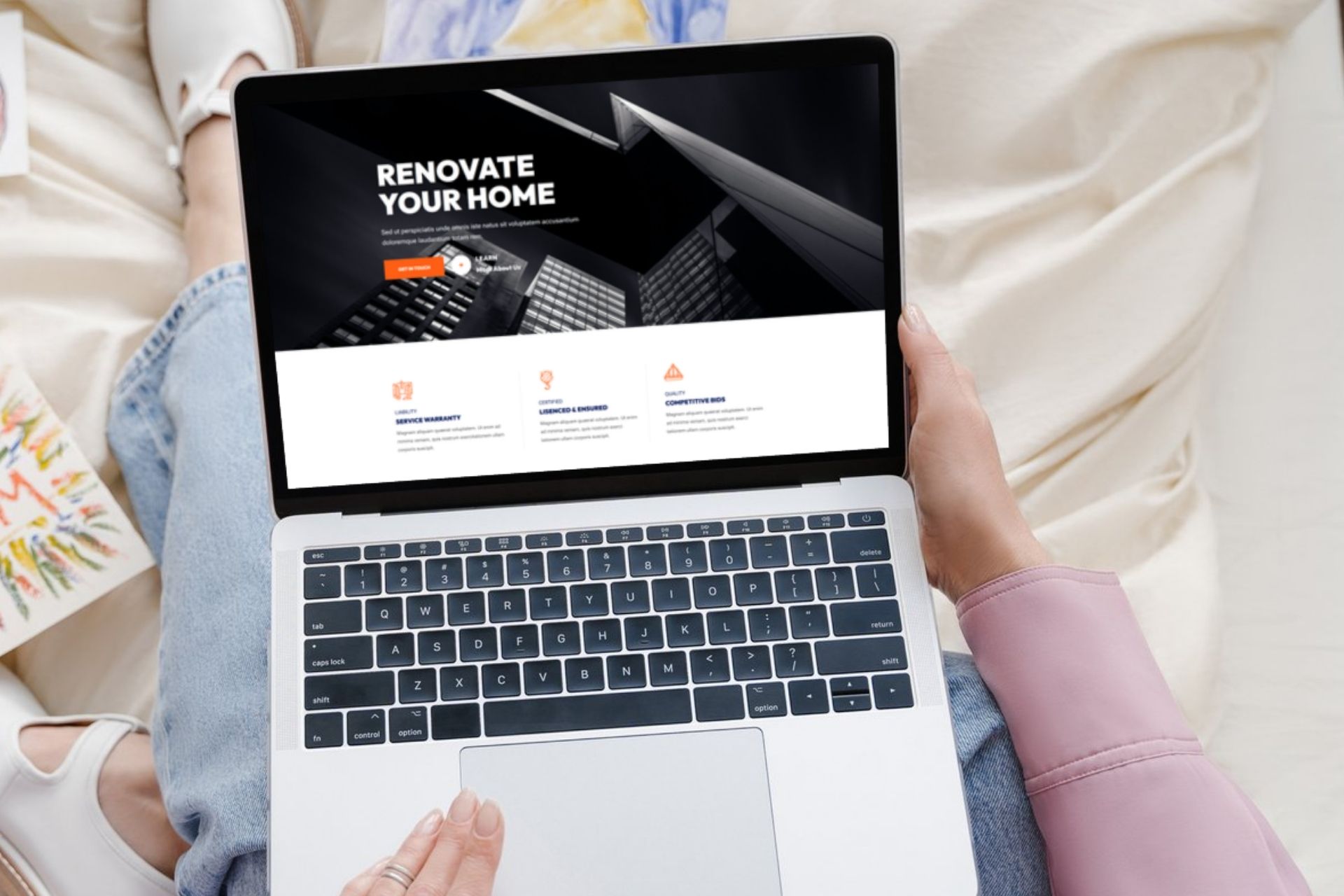 woman looking at contractor website on laptop