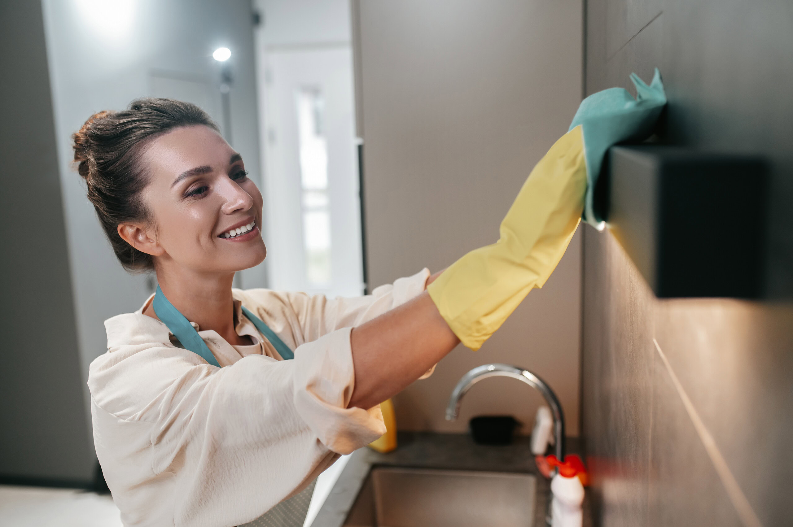 professional cleaner cleaning kitchen