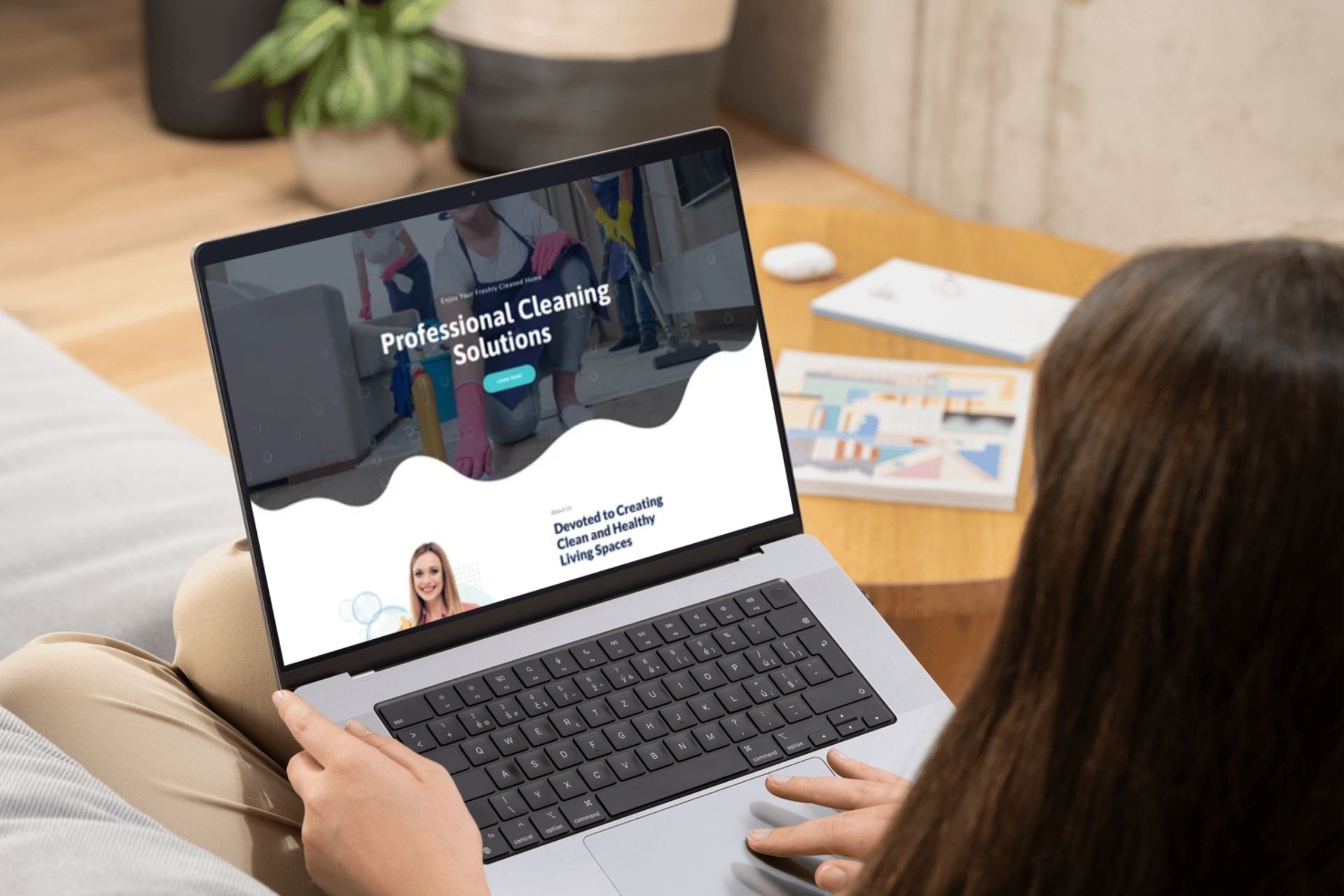 woman with laptop looking at professional cleaning service website