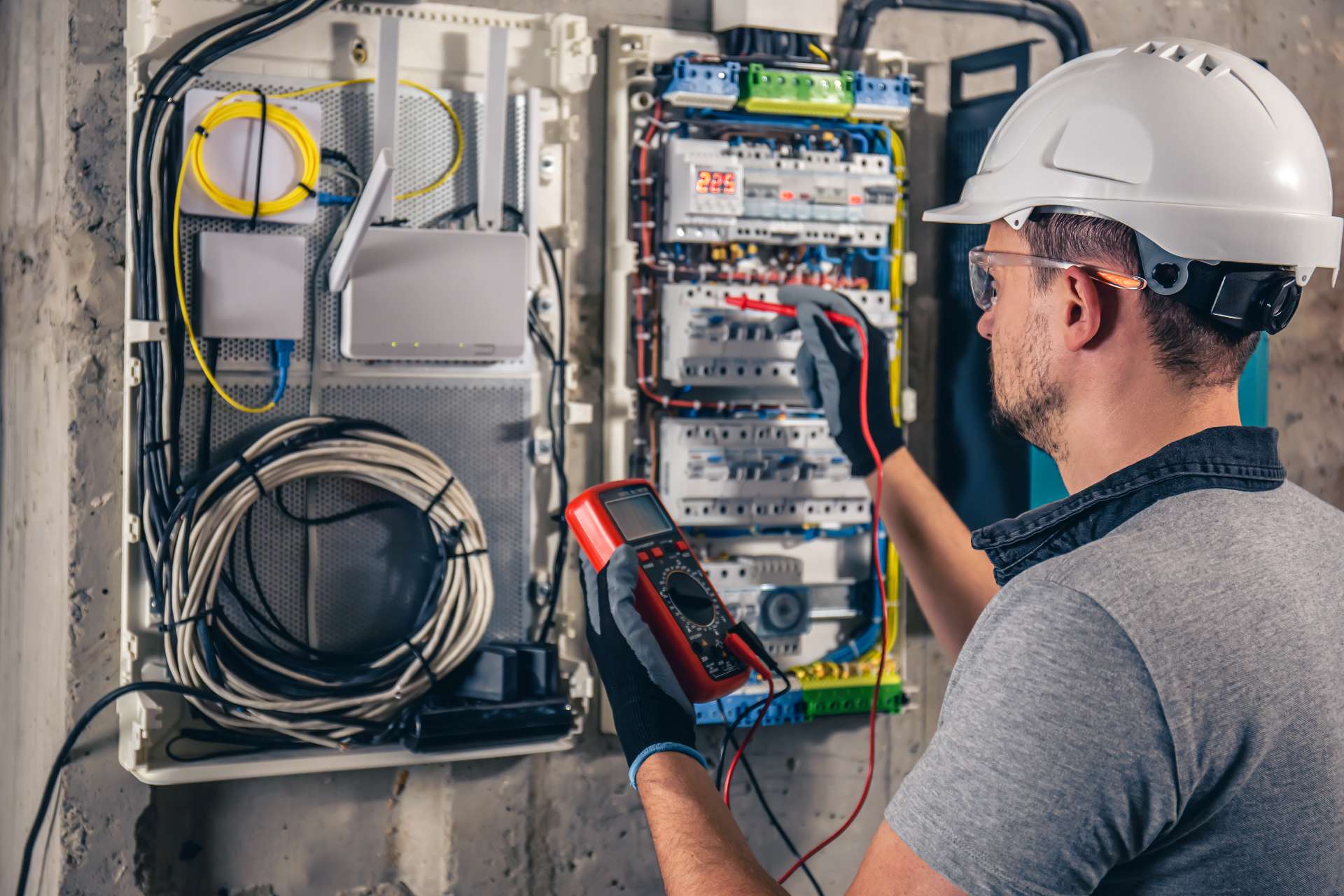 electrician working at an electrical panel