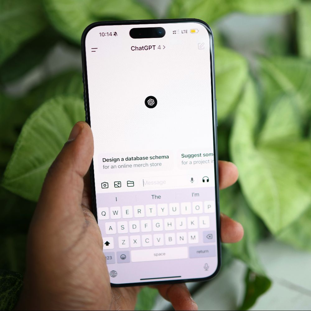 man holding phone showing chatgpt, supporting ai citations via link building