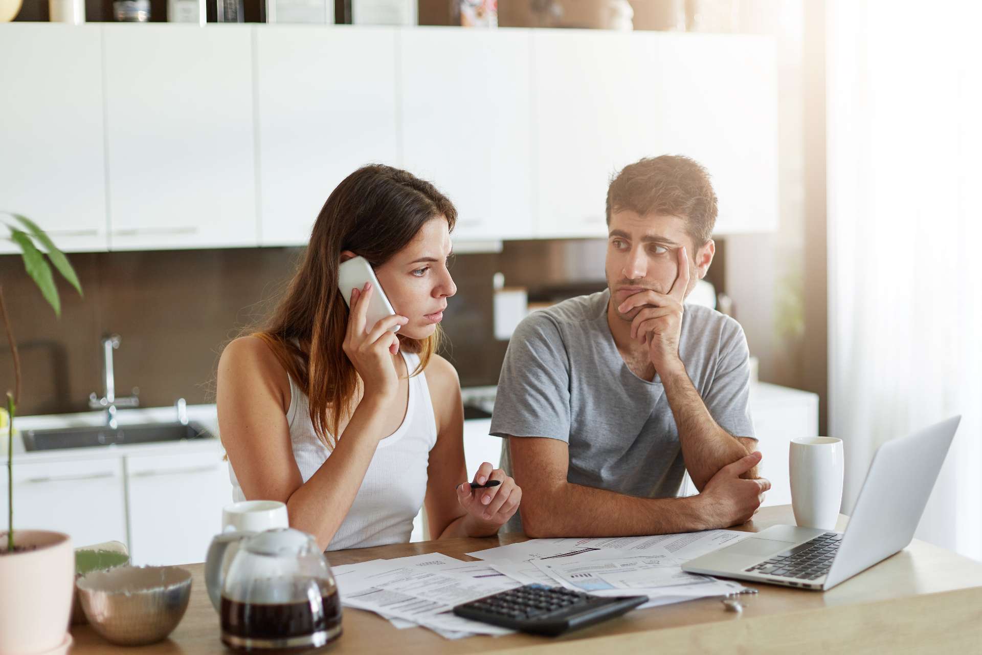 young couple searching for a plumber online