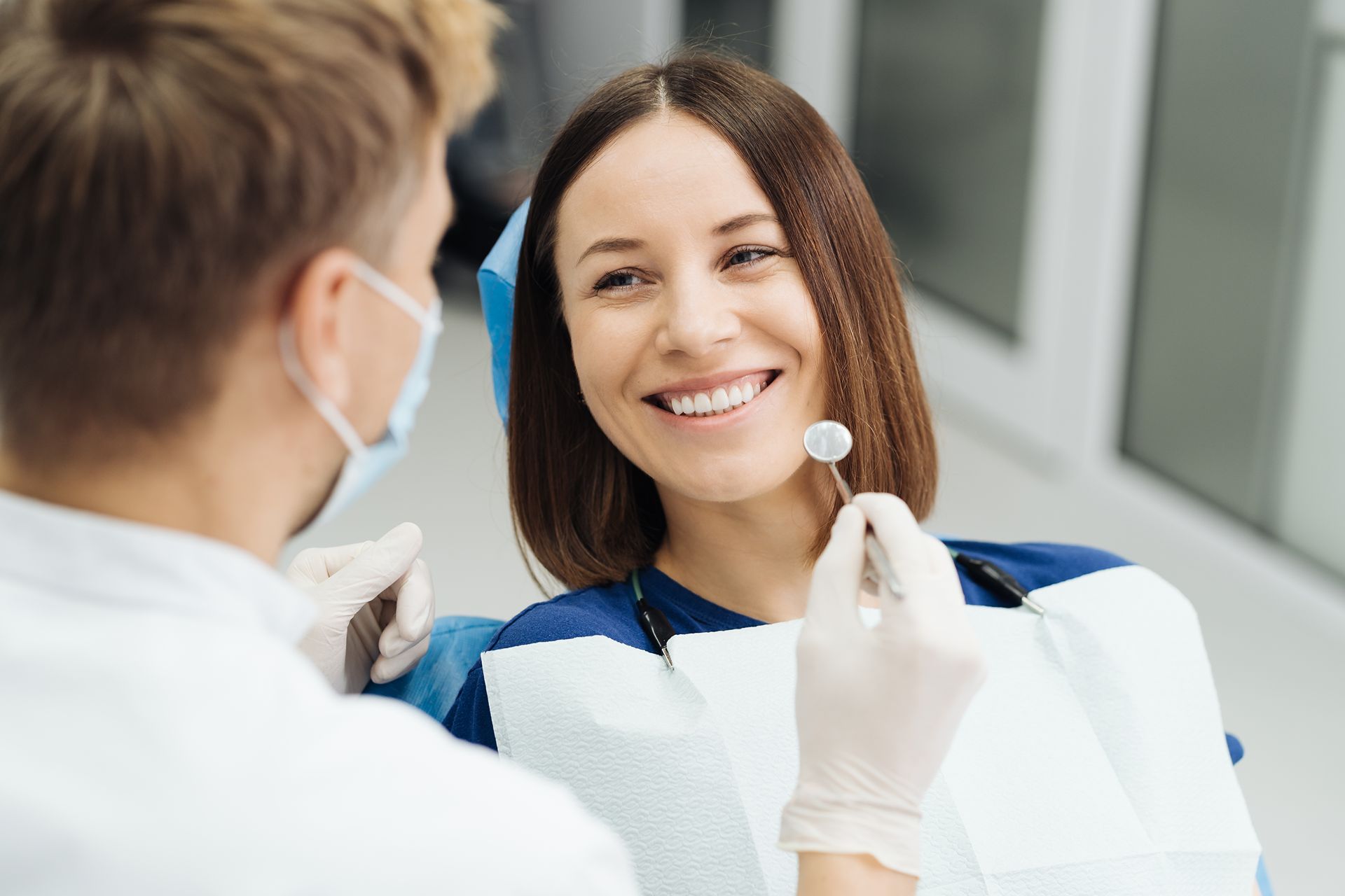woman smiling in dentist's chair