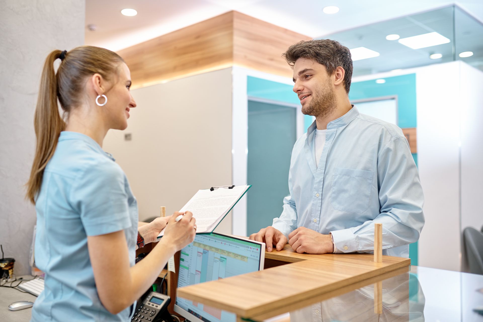 patient checking in at dental office