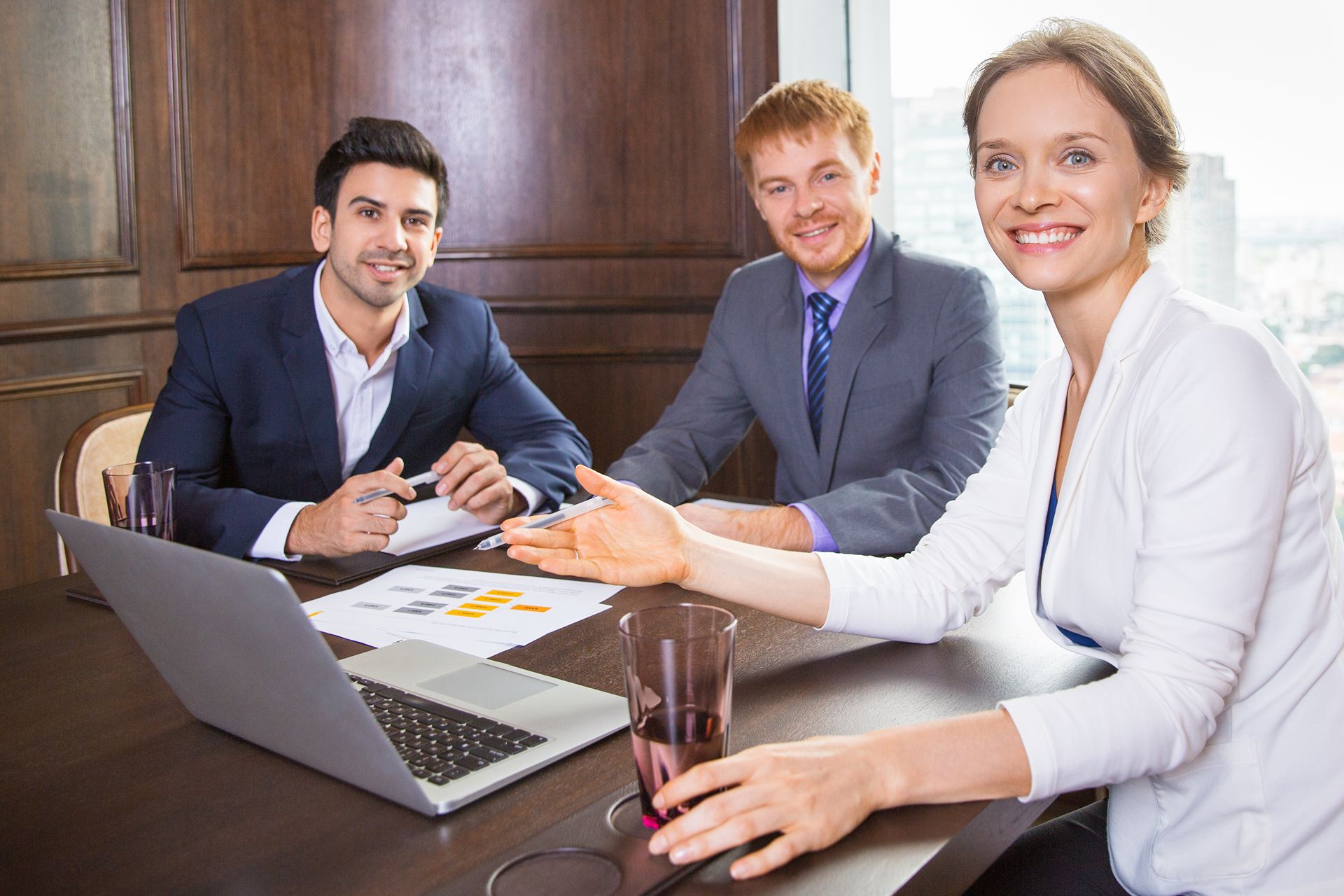 Lawyers meeting with a client in a conference room