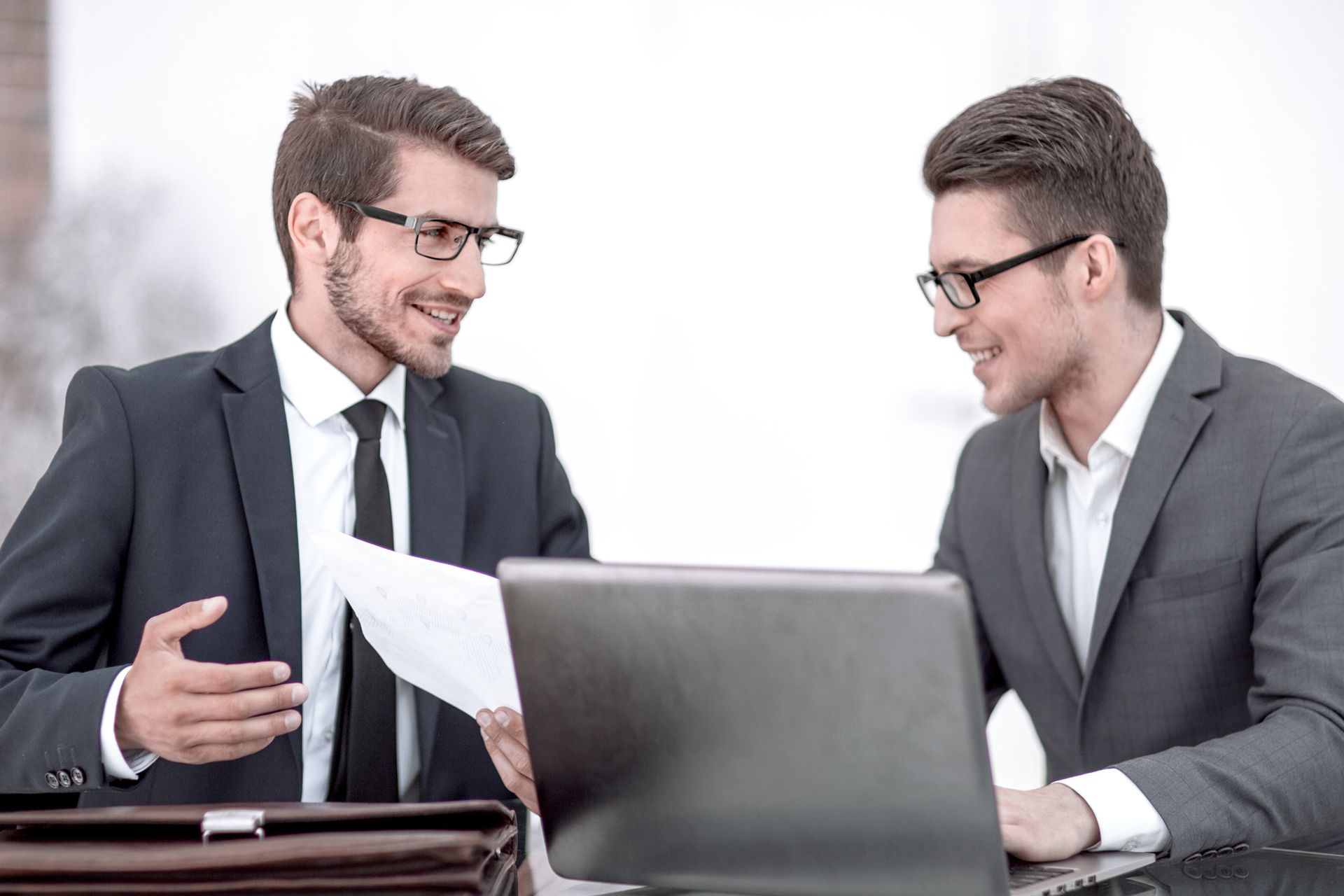 two lawyers happily discuss the local search results of their seo for lawyers