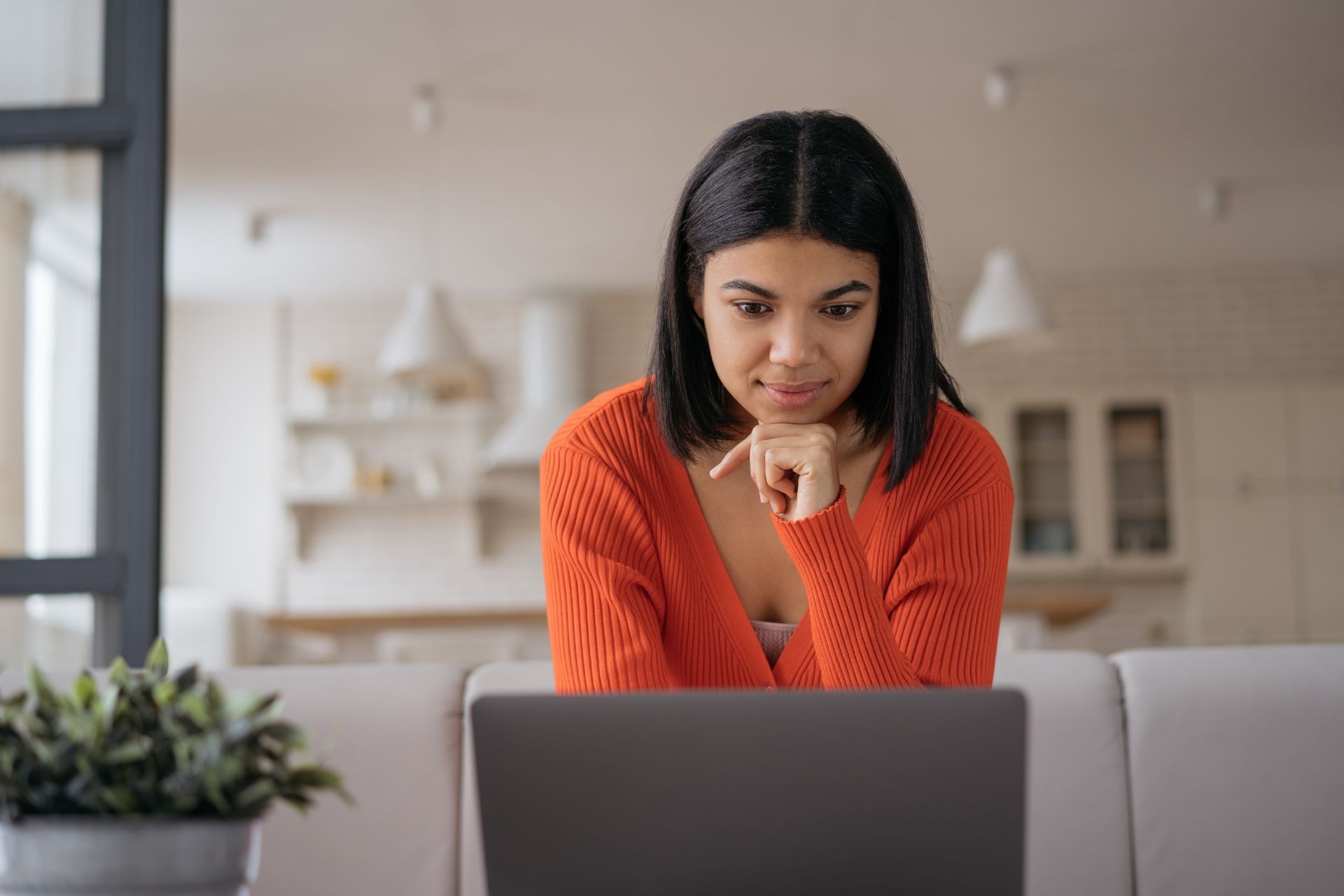 woman looking at laptop searching online for a lawyer