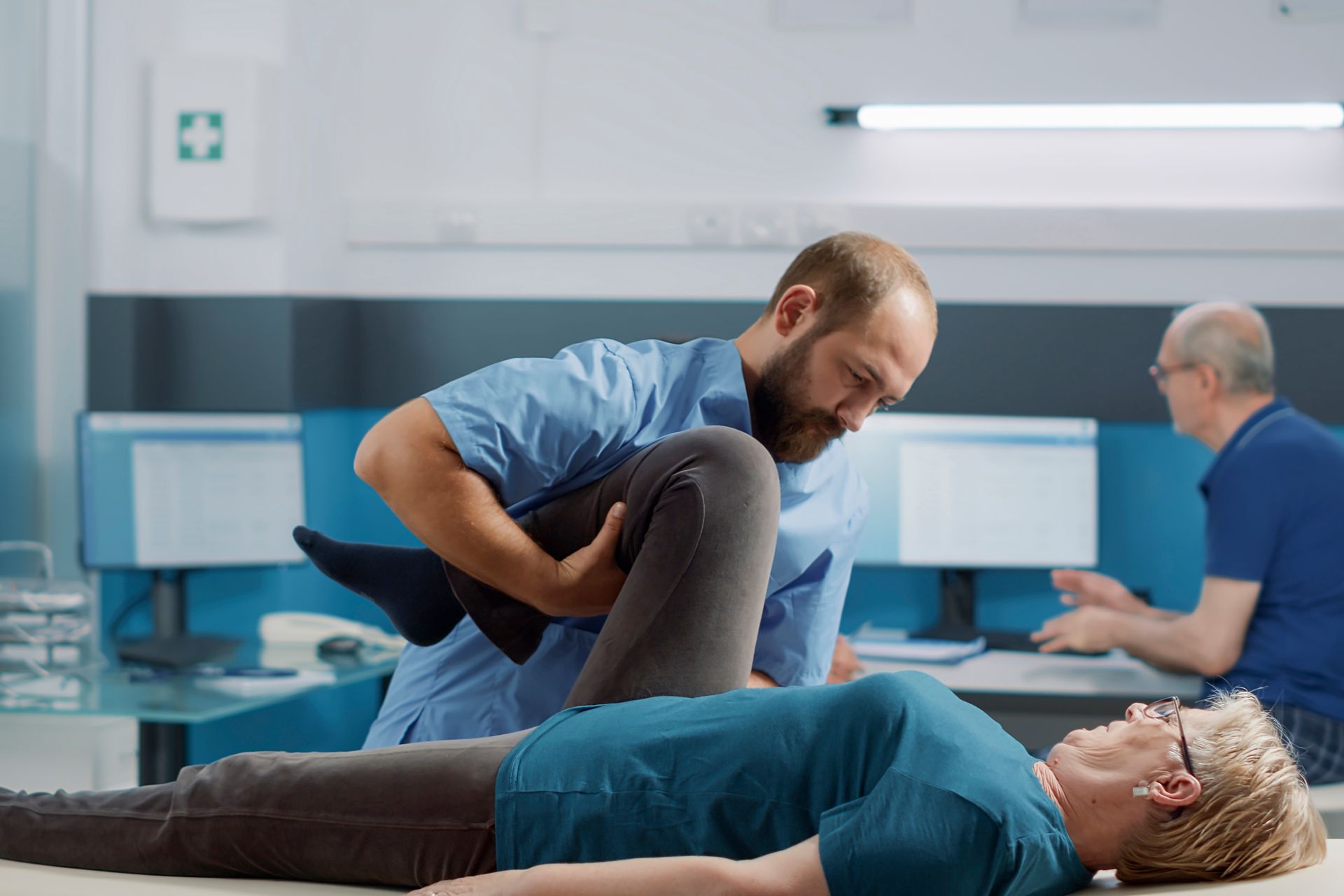 chiropractor working with patient