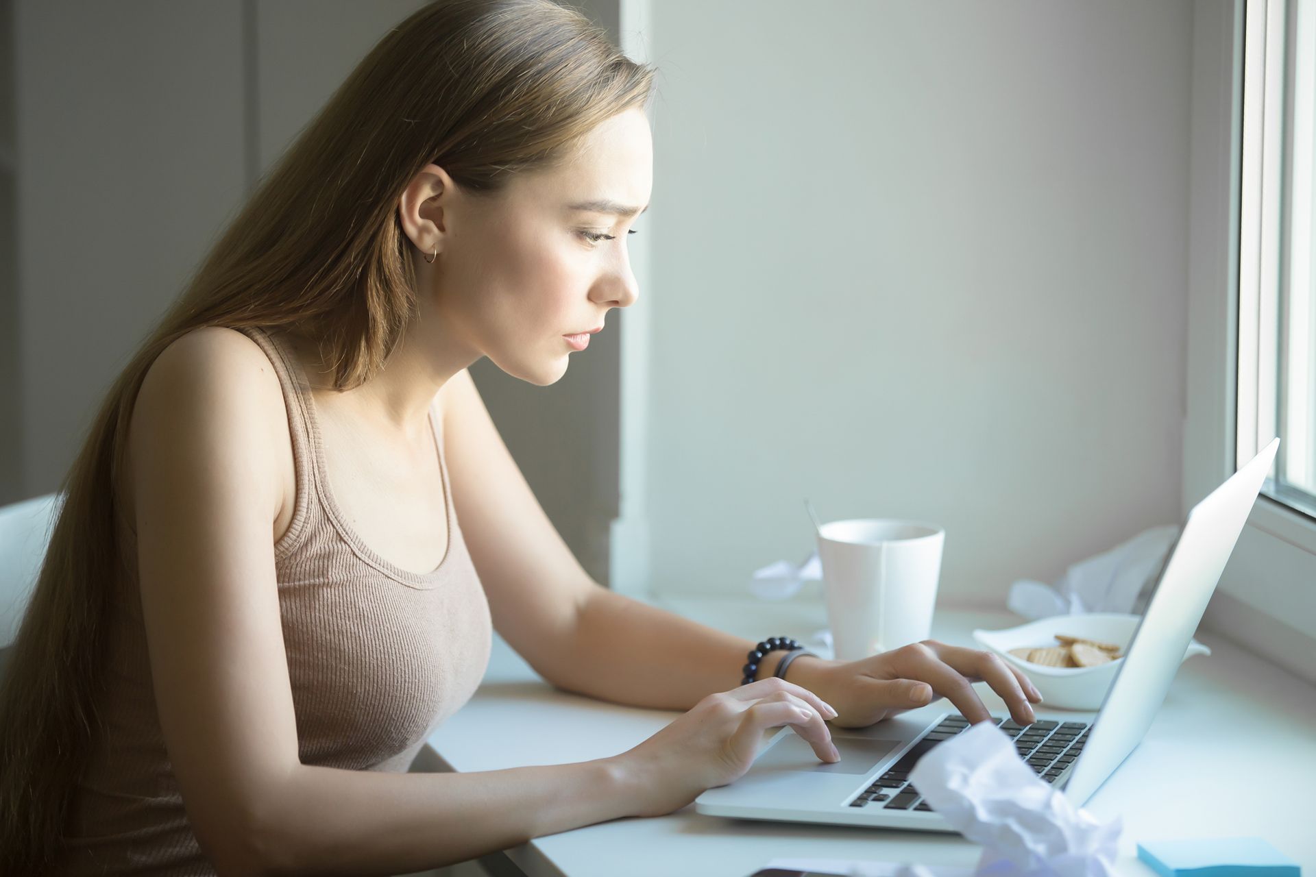 serious woman searching online for a therapist