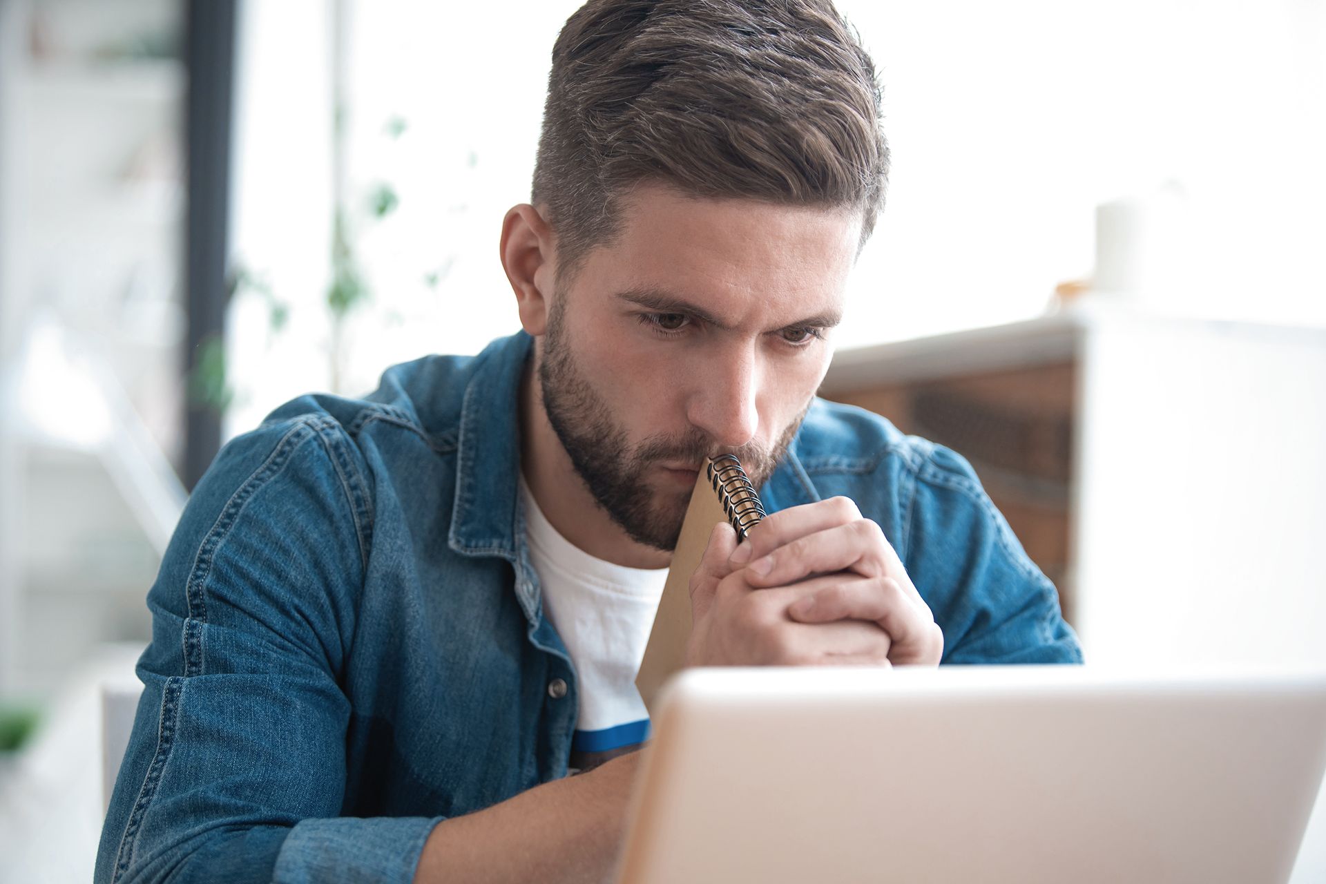 stressed looking man searching for a law firm online