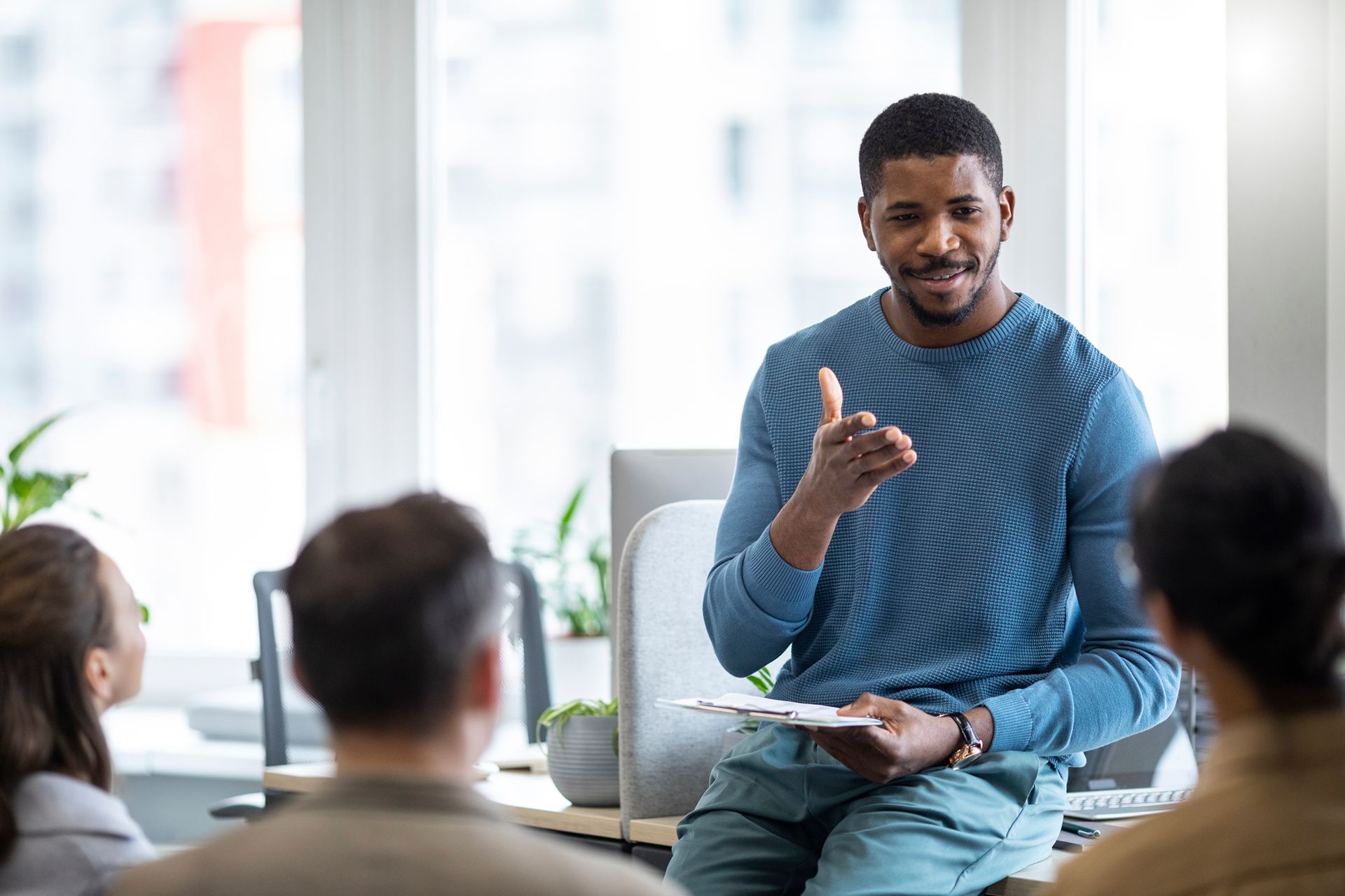 business coach working with team in office