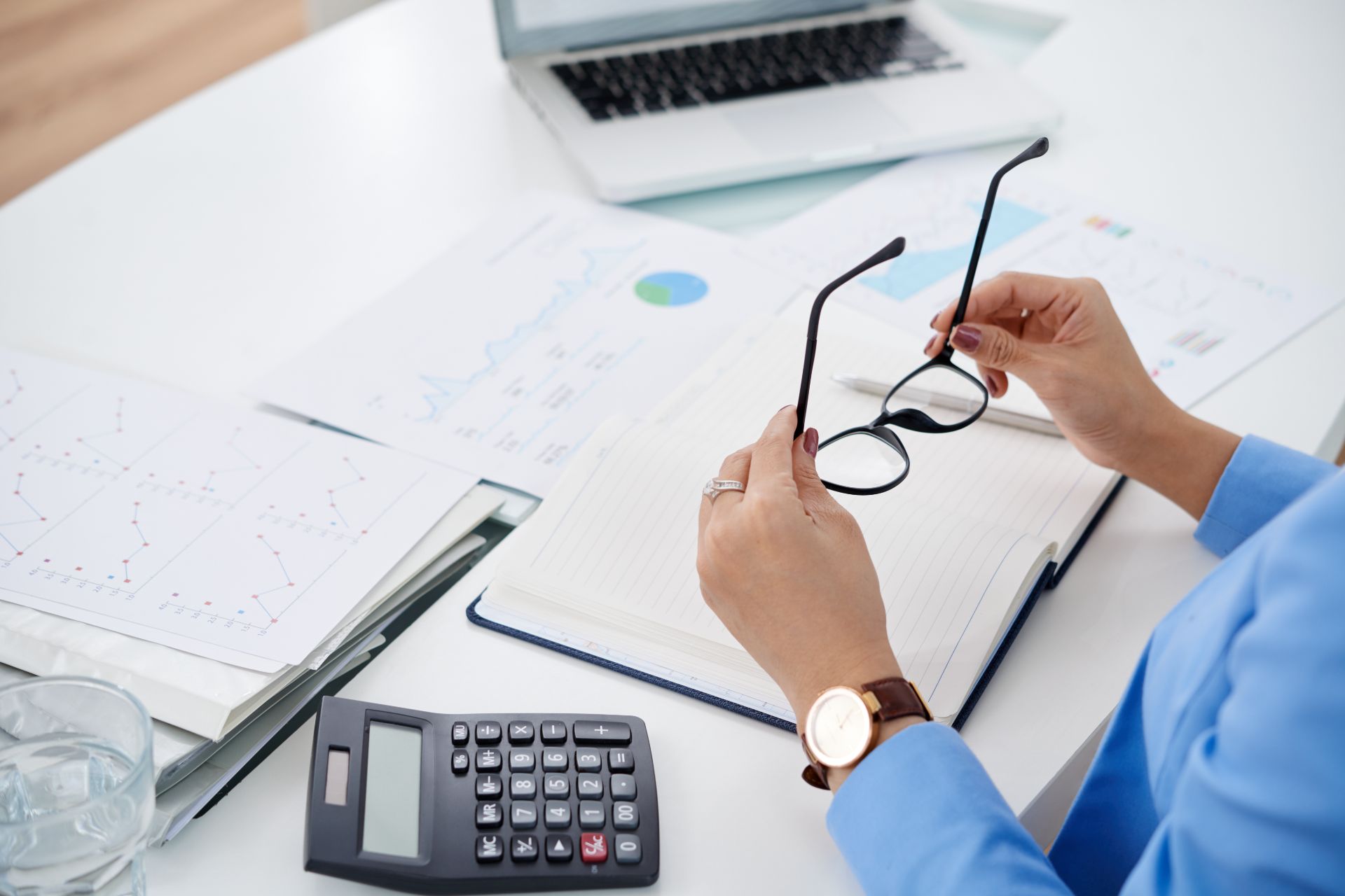 close up of accountant's desk with financial papers