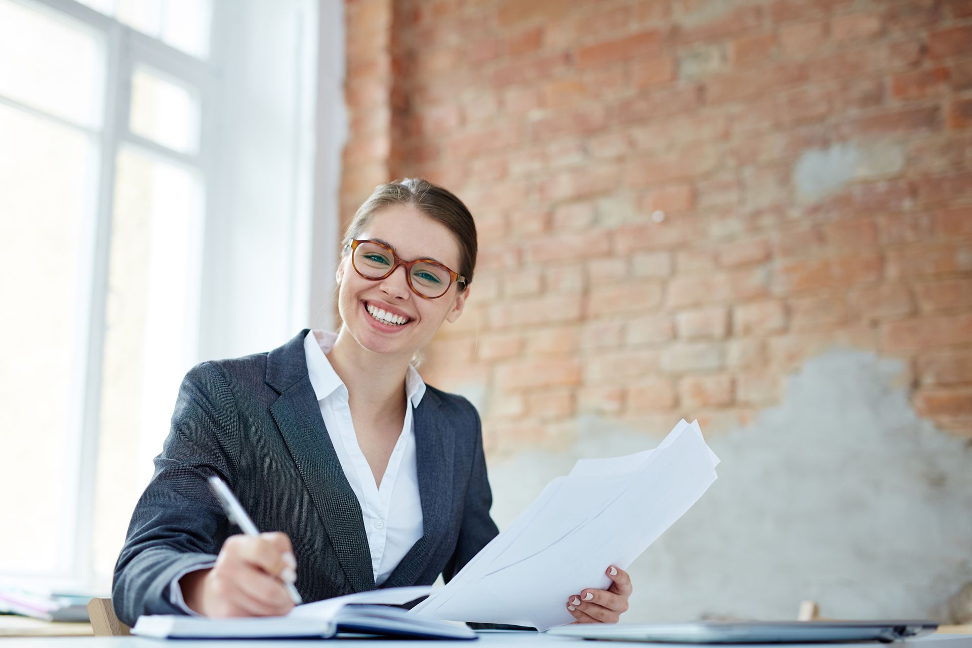 smiling accountant working at her desk