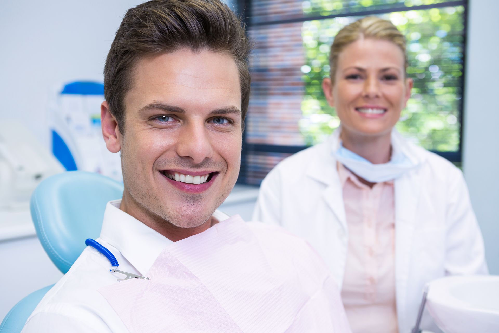 man smiling at the dentist office