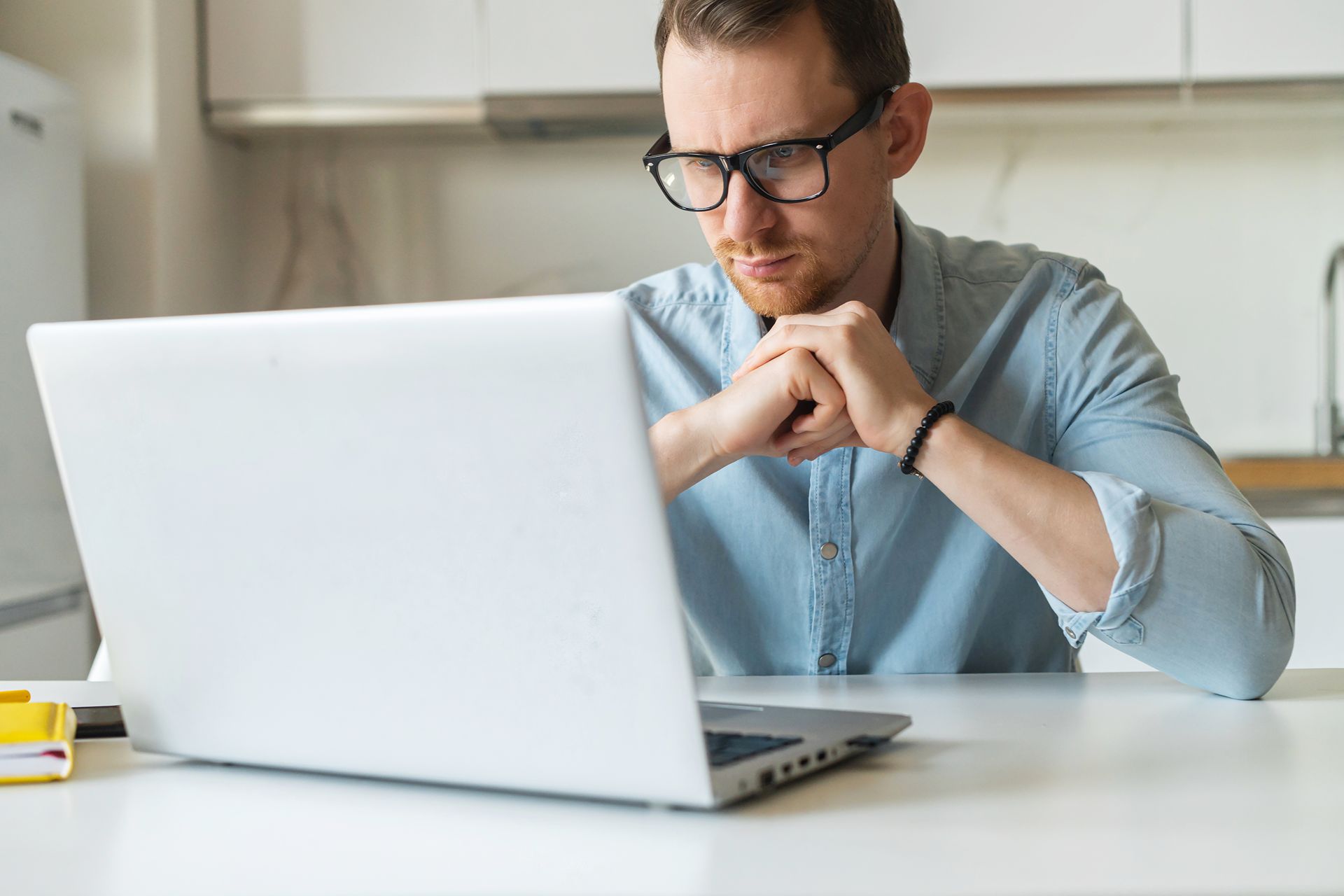 man searching online with a concerned look