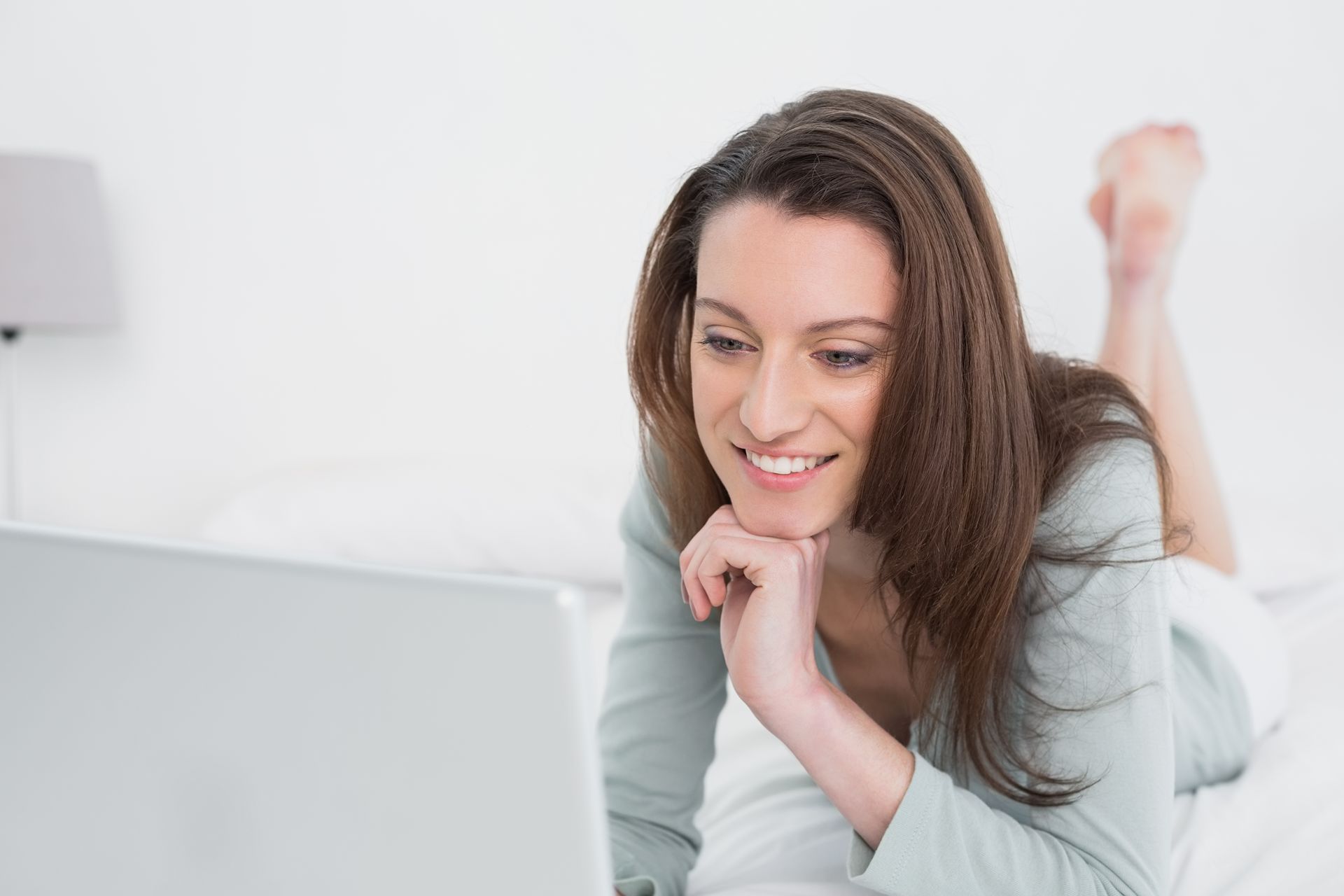 attractive woman searching and booking online for a hair salon 