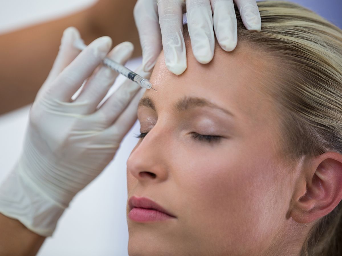relaxed woman getting a facial injection