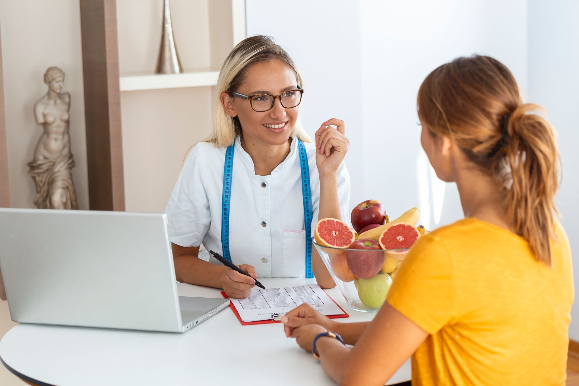 nutritionist consulting with a client