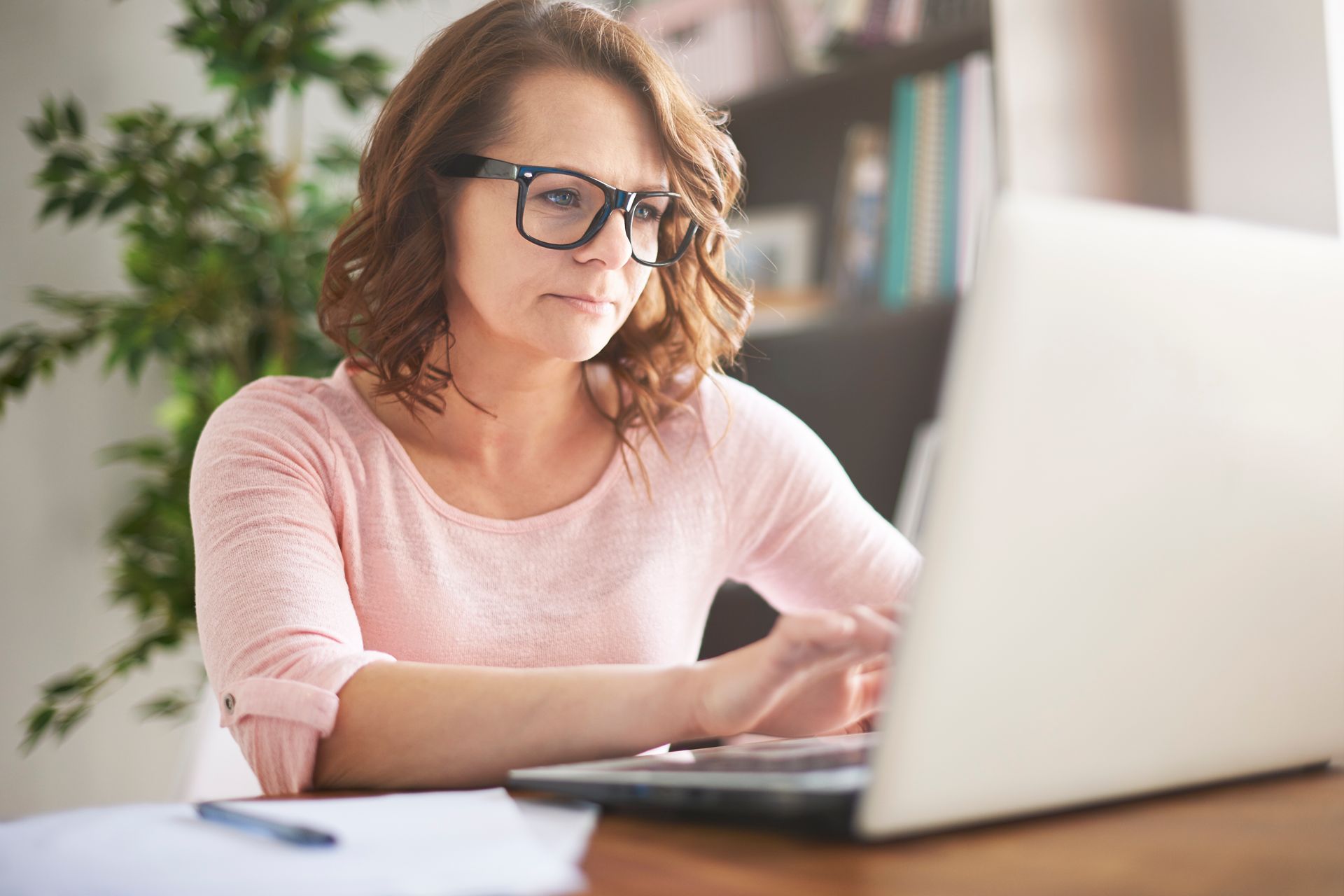 business woman researching on her laptop