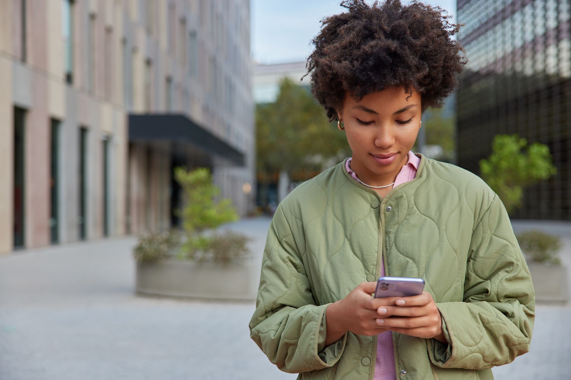 woman looking at cell phone for restaurant reviews