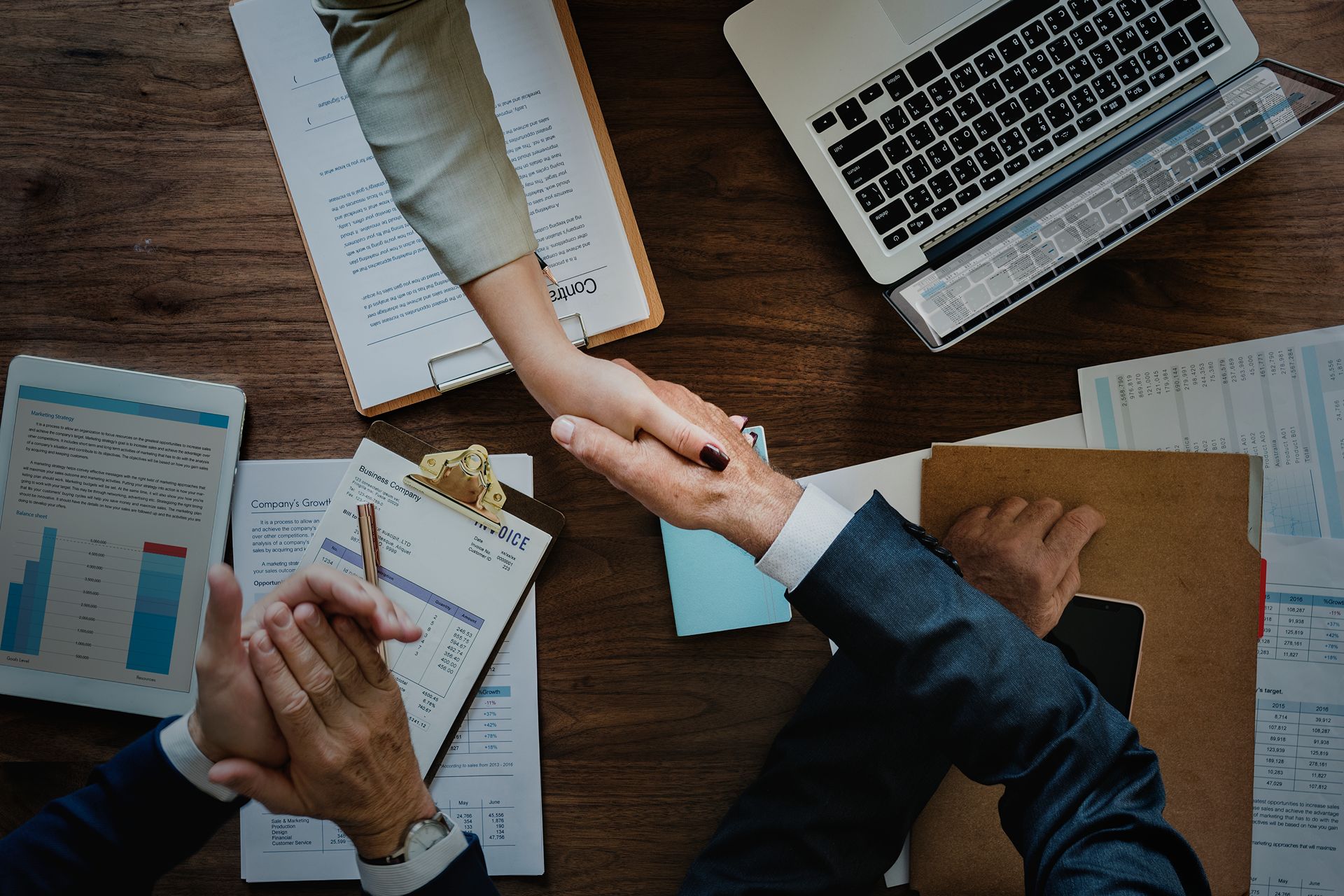 close up of hand shake of franchise development team making agreement