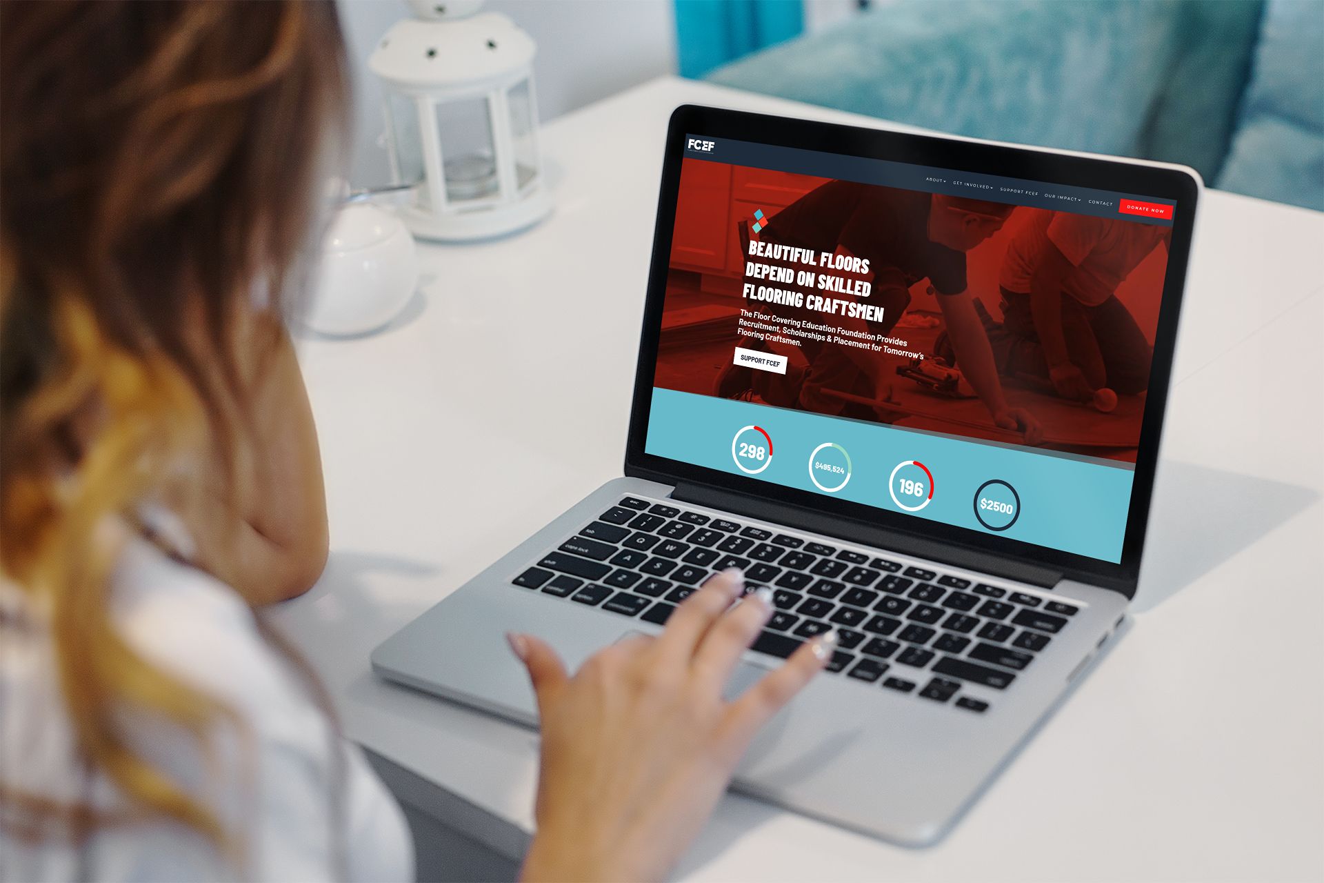 woman looking at fcef.org on a laptop